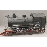 A large metal model of a steam locomotive. 116 cm long.