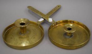 Two 18th/19th century brass chambersticks. Each 37 cm long.