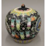 A Chinese famille noir ginger jar. 22.5 cm high.