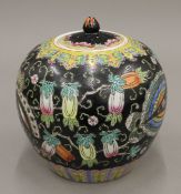 A Chinese famille noir ginger jar. 22.5 cm high.