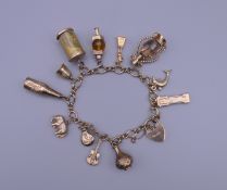 A 9 ct gold charm bracelet. 26 grammes total weight.