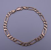 A 9 ct gold gentleman's figaro bracelet. 14 grammes.