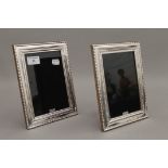 A pair of silver photograph frames. 22 cm high.