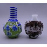 Two Chinese cameo glass snuff bottles. The largest 6.5 cm high.