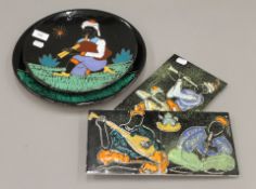 Two plaques and two sets of two tiles depicting musicians. The largest 31 cm diameter.