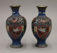 A pair of cloisonne vases. 18 cm high.