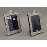 A pair of silver photograph frames. 20.5 cm high.