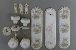A quantity of door plates and knobs.