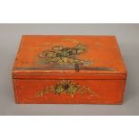 A red chinoiserie box. 27.5 cm wide.