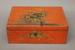 A red chinoiserie box. 27.5 cm wide.