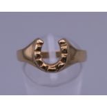 A 9 ct gold horseshoe ring. Ring size Q. 2.3 grammes.