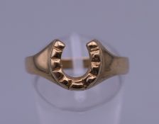 A 9 ct gold horseshoe ring. Ring size Q. 2.3 grammes.