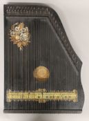 A 19th century German zither. 35 cm wide.