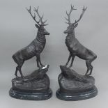 A pair of bronze stags on plinth bases. 74 cm high.