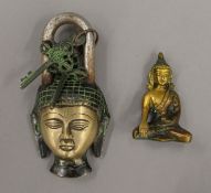 A padlock formed as the bust of Buddha and a small bronze model of Buddha. The former 15 cm high.