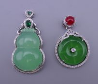 Two jade pendants. The largest 5.5 cm high.