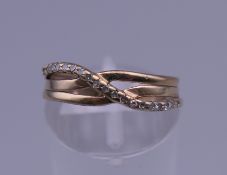 A 9 ct gold diamond ring. Ring size J/K. 2.4 grammes total weight.
