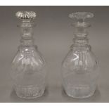 Two 19th century ring neck cut glass decanters. The largest 25 cm high.