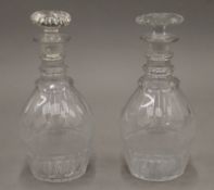 Two 19th century ring neck cut glass decanters. The largest 25 cm high.