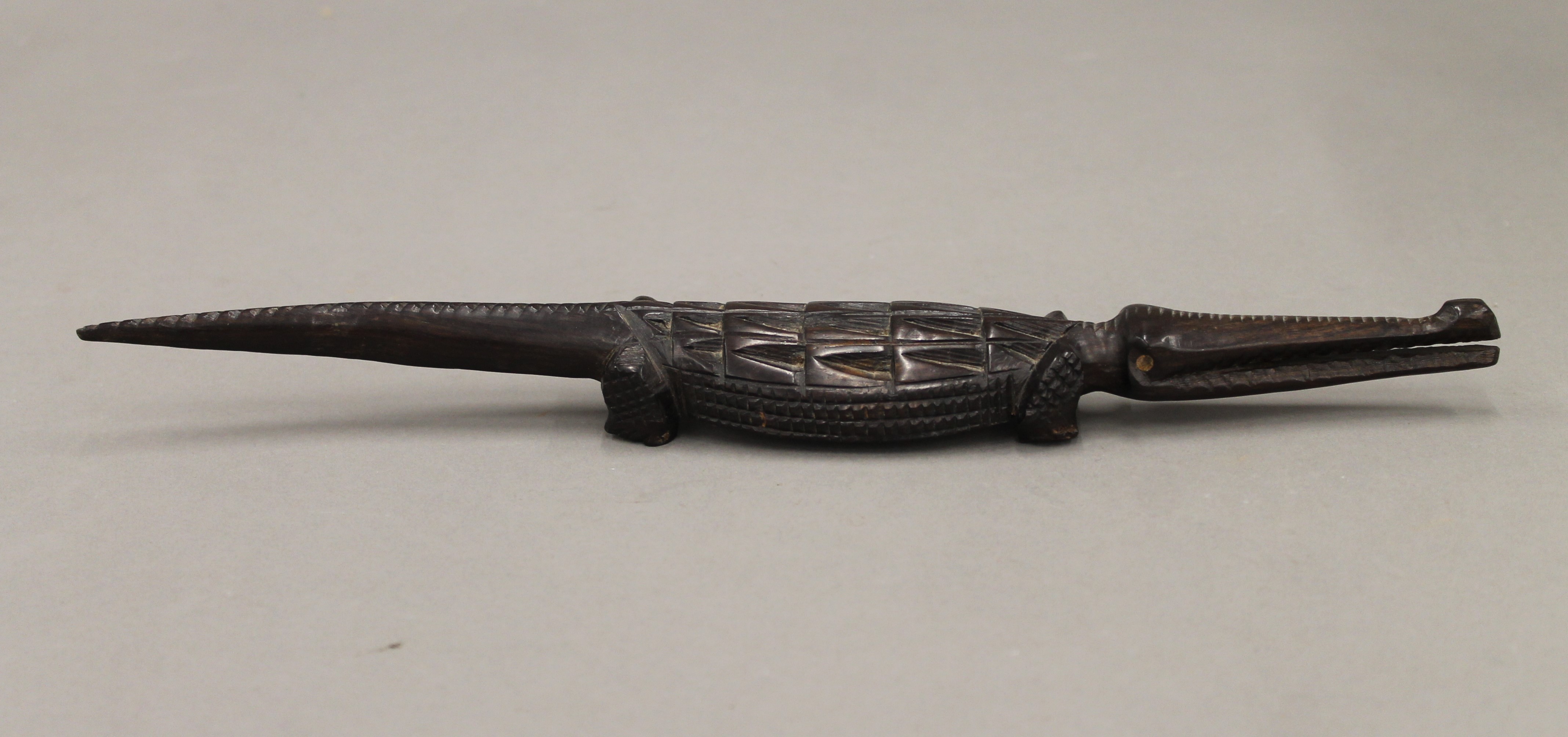 An African carved table, a male bust and a crocodile. The former 36.5 cm high. - Image 9 of 10