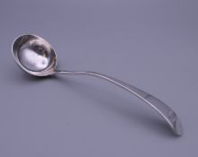 A Tiffany silver ladle. 14 cm long.