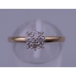 A 9 ct gold diamond cluster ring. Ring size P. 1.4 grammes total weight.