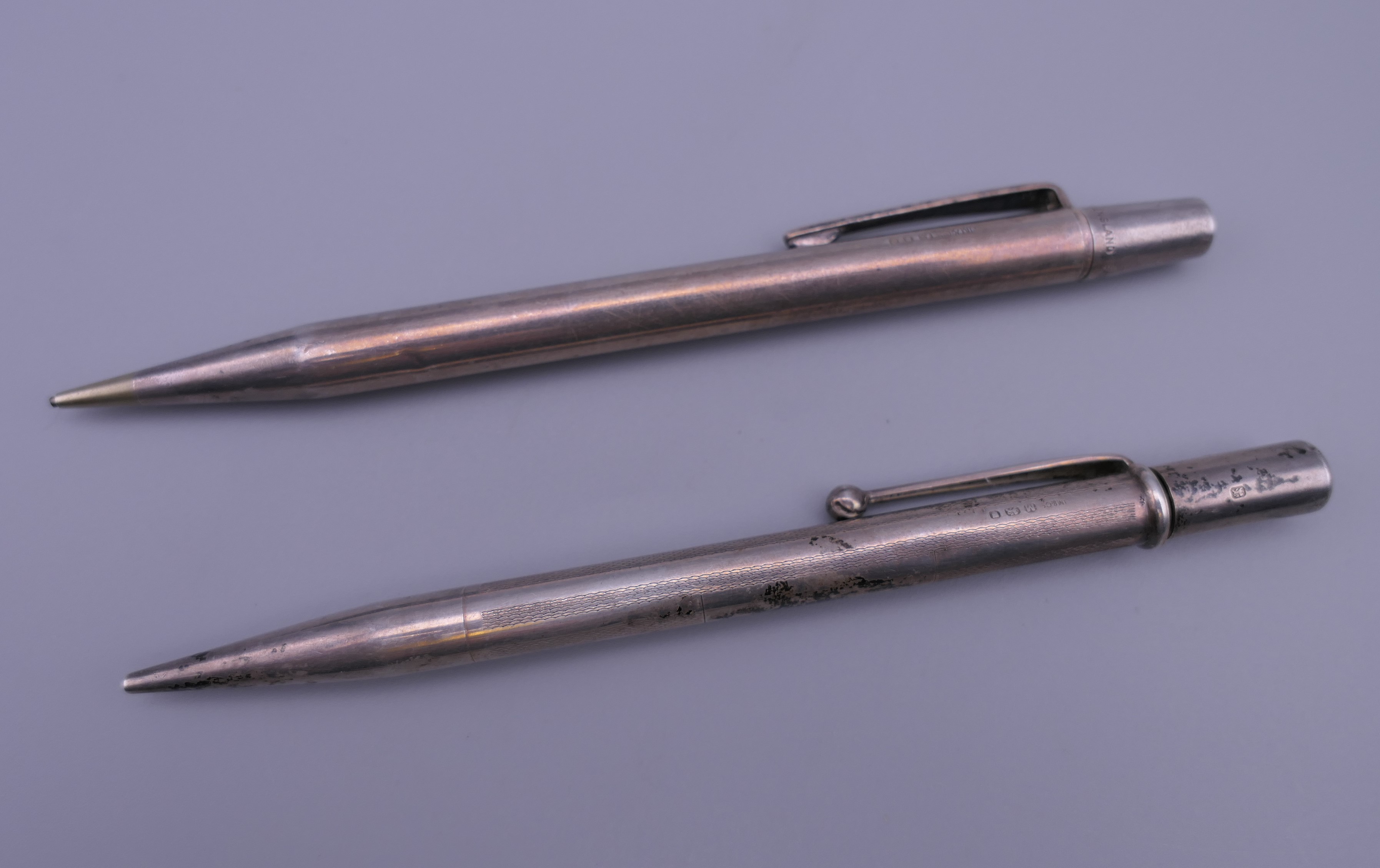 A silver hallmarked Yard O Lead pencil and another silver hallmarked pencil.