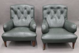 A pair of Howard style leather upholstered Victorian armchairs. Each 80 cm wide, 83.