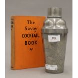 A Kut Hing Swatow pewter cocktail shaker depicting a dragon and The Savoy Cocktail Book 1933.