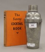 A Kut Hing Swatow pewter cocktail shaker depicting a dragon and The Savoy Cocktail Book 1933.