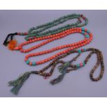 Three sets of beads. The longest 103 cm long.