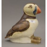 A Studio Pottery model of a puffin, with incised mark to underside. 26 cm high.