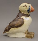 A Studio Pottery model of a puffin, with incised mark to underside. 26 cm high.