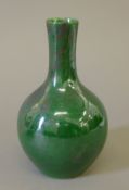 A Chinese porcelain green vase. 16 cm high.