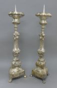 A pair of silver plated pricket sticks. 76 cm high.