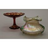 A Leotz type iridescent glass vase and a gilded ruby glass tazza. The latter 10.5 cm high.