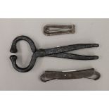 A vintage iron bull leader and two horse bits. The former 23.5 cm long.