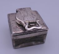 A silver topped glass inkwell. 4.5 cm square.