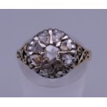 A yellow metal/unmarked gold and old cut diamond ring. Ring size N/O. 3.7 grammes total weight.