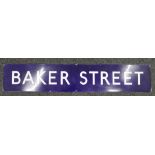 An original Baker Street enamel railway sign and a copy of Sherlock Holmes My Life and Crimes book.