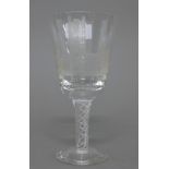 A 1973 Ely Cathedral Commemorative engraved air twist stem wine glass. 17 cm high.