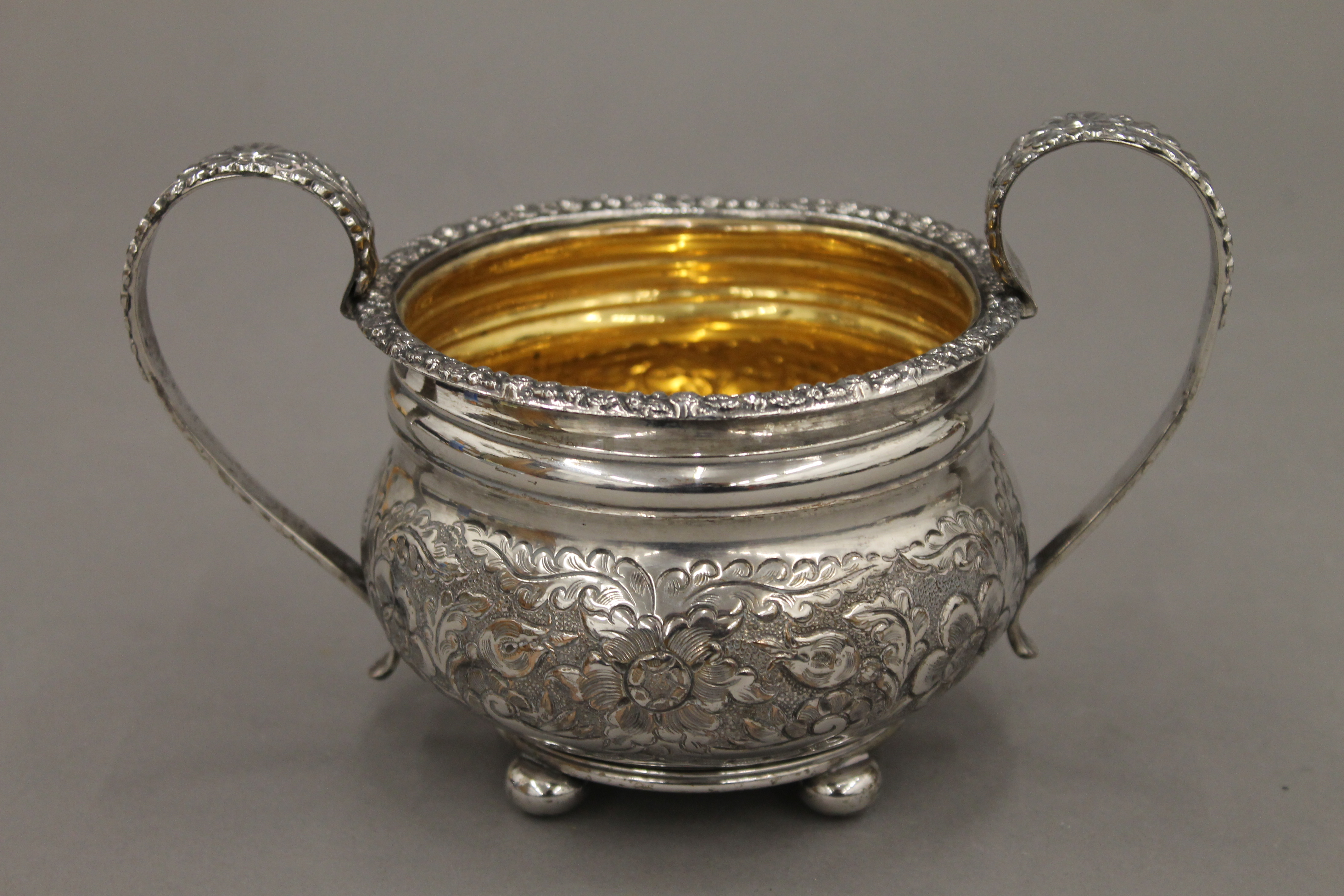A Victorian three-piece ornate silver plated tea set and a tray. - Image 4 of 4