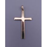 A 9 ct gold cross pendant. 3.1 grammes.