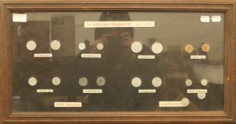 A framed and glazed collection of French coins. 67 x 35.5 cm.