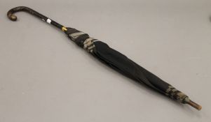 An early 20th century ladies tortoiseshell handled umbrella owned by Lalocke Huth of 44 Upper