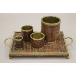 A vintage leather mounted brass desk set. Tray 33.5 x 21 cm.