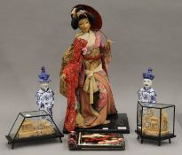 A quantity of Oriental items, including a model of a geisha,