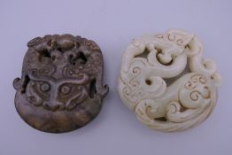 Two jade roundels. Each approximately 5.5 cm diameter.