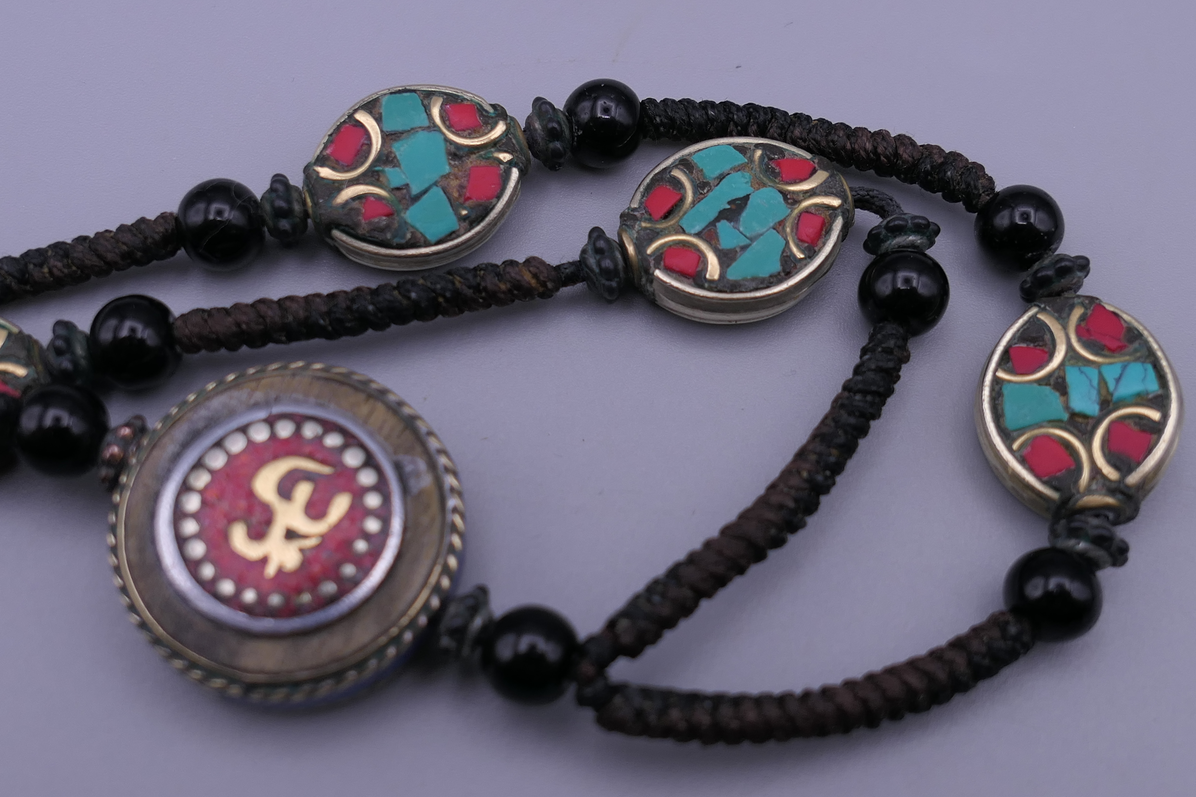 A Tibetan necklace and an African glass bead necklace. - Image 3 of 4