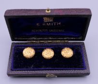 A cased set of three 18 ct gold shirt studs. 3.6 grammes.